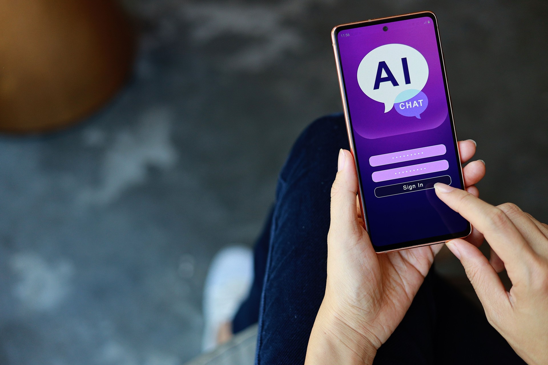 Close-up woman using smartphone chatting with AI chatbot